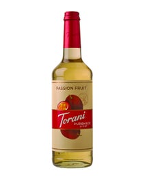 Torani Puremade Passion Fruit Syrup in a glass bottle with cut passion fruit illustrations